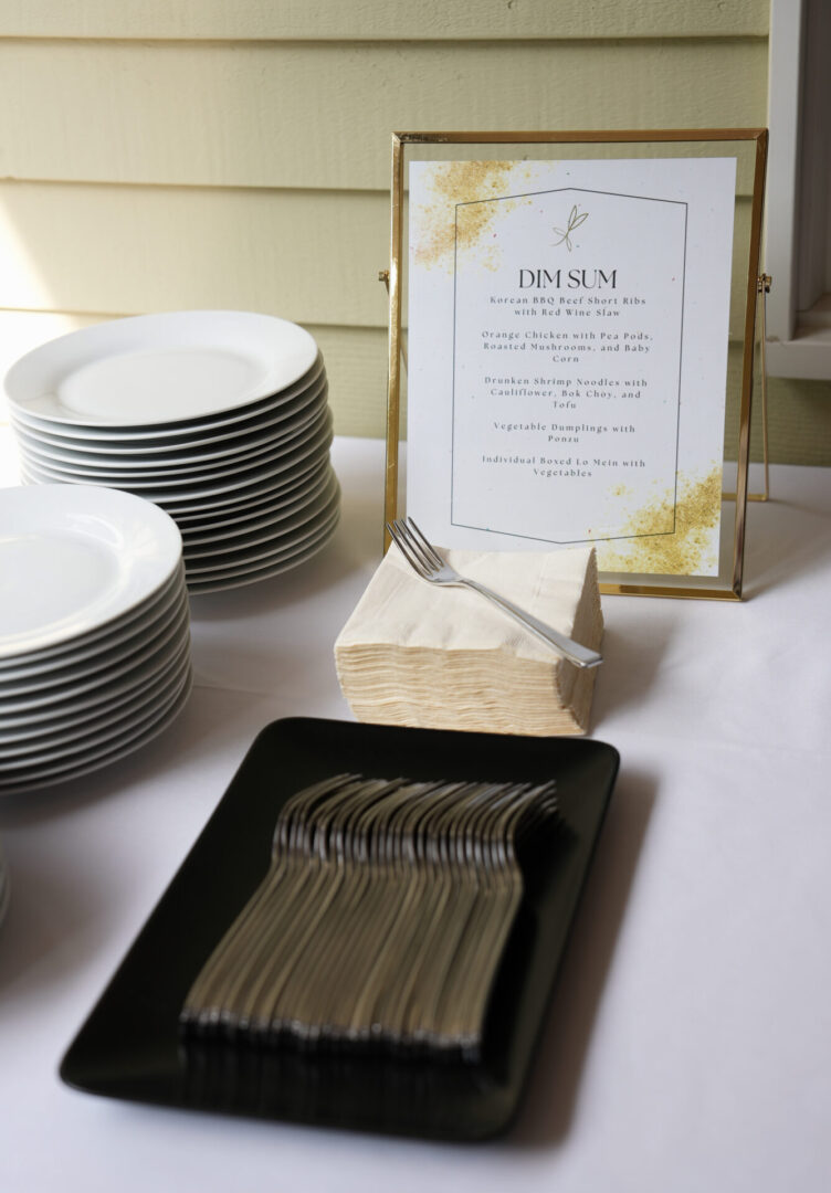 A table with plates and a menu on it